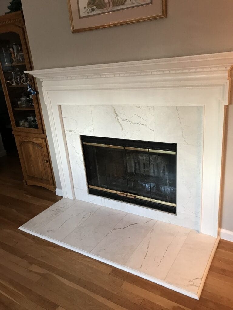 White marble wood burning fireplace